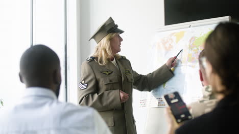 woman explaining situation with a map at the conference