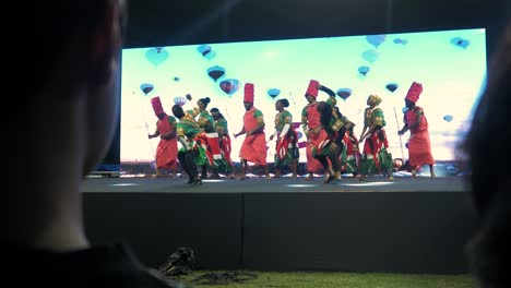 african dance performance on stage enjoyed by the audience