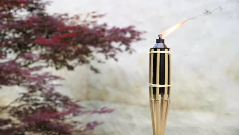 bamboo torch burning, decorative tropical candle