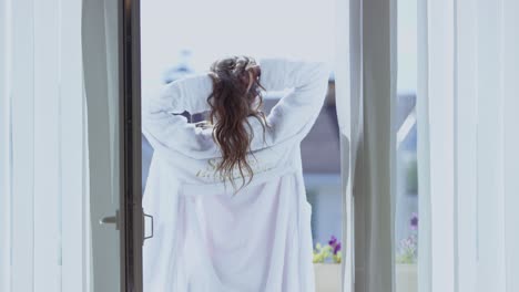 woman stretching in a hotel room