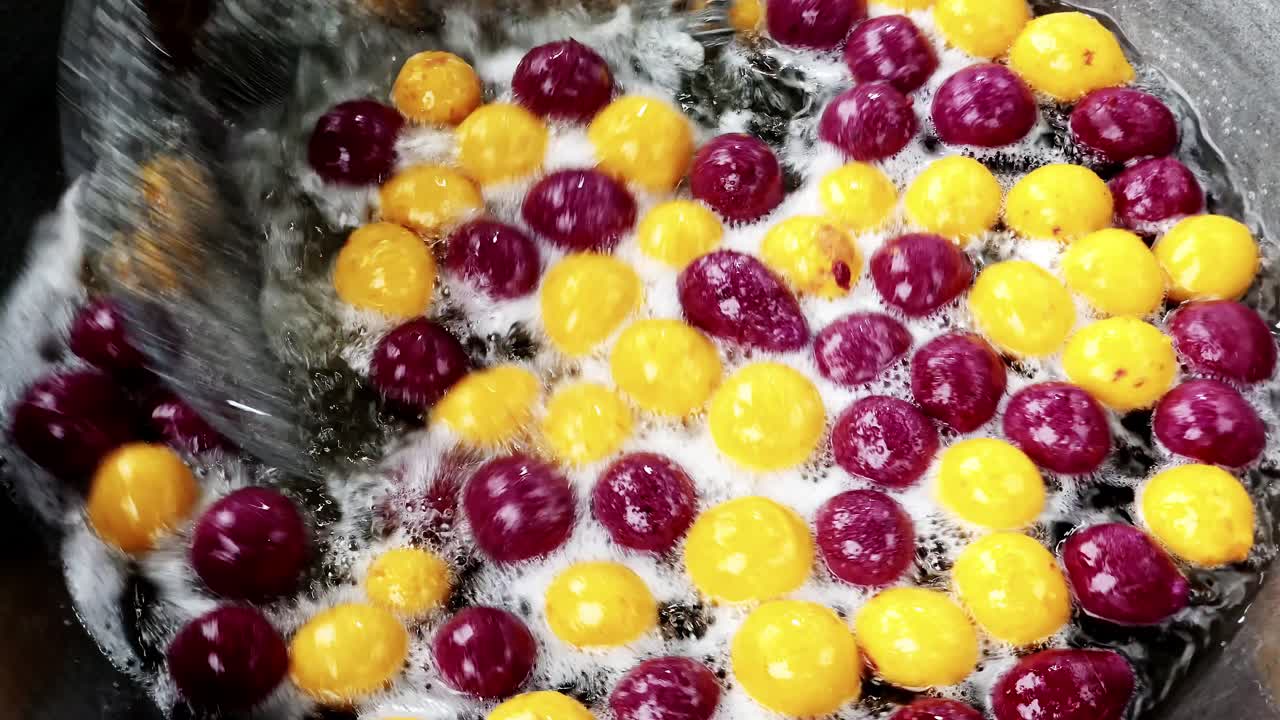 Witness the vibrant colors of fruits being cooked capturing the essence of culinary artistry