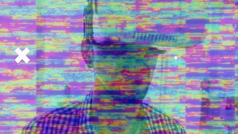 tv static effect and abstract shapes against kaleidoscopic pattern over man wearing vr headset