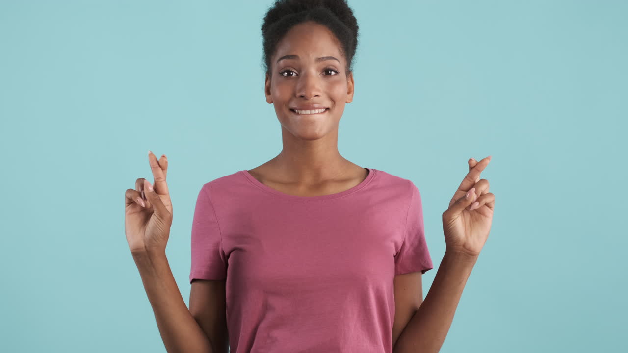 Nervous girl crossing fingers