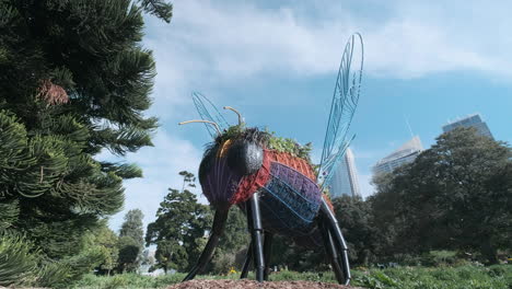 an unusual sight in sydney’s botanical gardens - a giant bee made of flowers