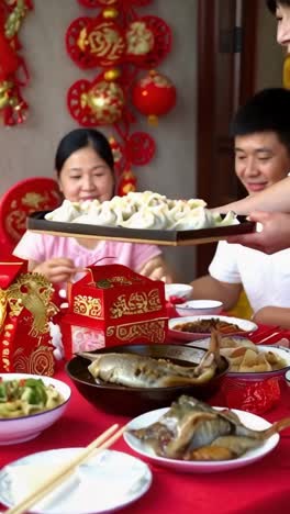a woman's hands holding a tray of traditional chinese food. chinese new year tradition.