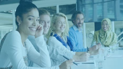 Animation-of-data-processing-over-portrait-of-diverse-male-and-female-colleagues-smiling-at-office