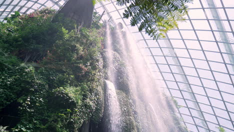 slow motion of waterfall feature at gardens by the bay in singapore