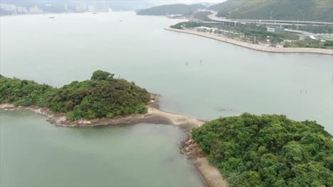 Hong-Kong-bay,-with-a-strip-of-sand-connecting-small-natural-islands,-Aerial-view