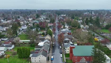 Rainy-and-clouds-day-in-small-american-town-with-colorful-trees-and-houses