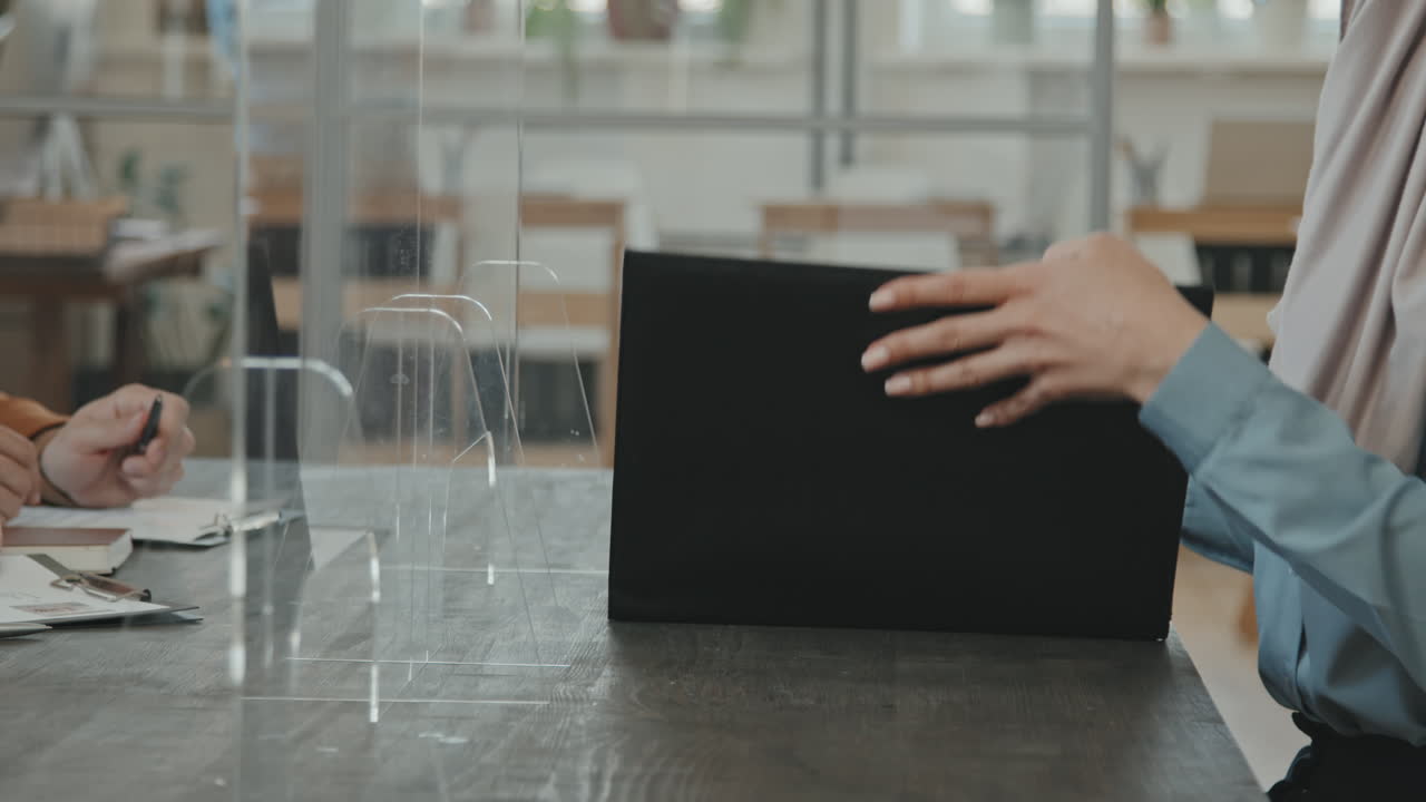 Muslim Woman Singing Contract at Job Interview