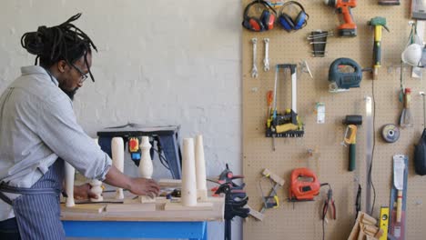 Carpenter preparing wooden column 4k