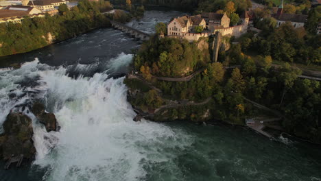 Fantastic-aerial-shot-in-orbit-and-at-a-medium-distance-from-the-falls-of-the-Rhine-and-where-the-castle-of-Laufen-can-be-seen