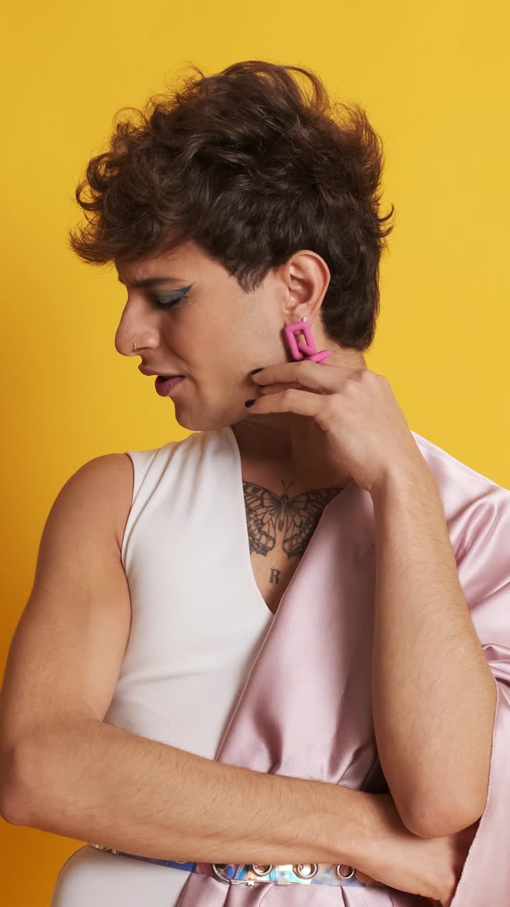 Sad and worried transgender man looking at the camera