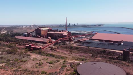 Aerial-drone-view-Port-Augusta-Whyalla-steelworks-buildings-shipyard-ocean-Adelaide-outback-travel-tourism-mining-industry-South-Australia-4K