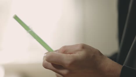 man's hand removed the plastic cover of drinking straw - removing wrapper of drinking tube