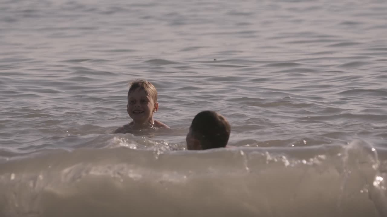 Children Playing in the Ocean