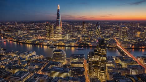 london cityscape at night with the shard and thames river
