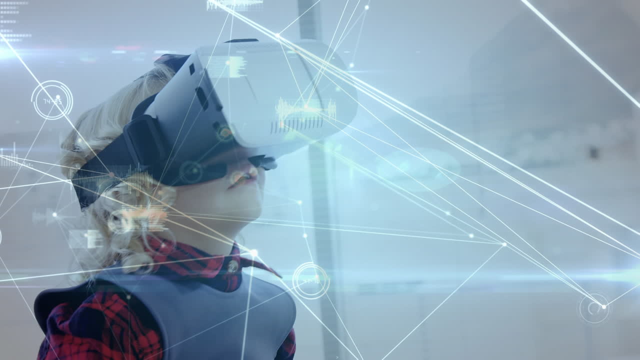 Bambino che agita le mani mentre indossa un visore per realtà virtuale