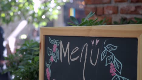 a rustic menu sign on a blackboard