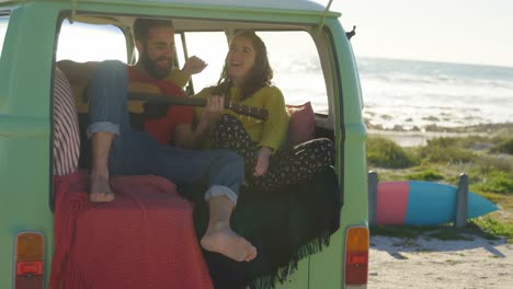 man play guitar for woman in the van 4k