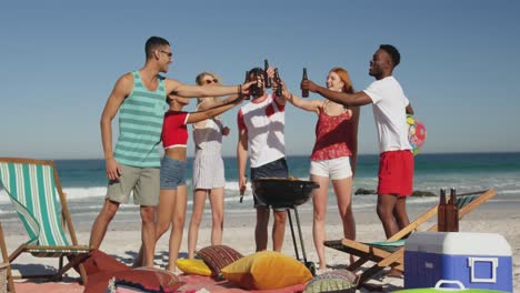 young adult friends having a barbecue on a beach 4k