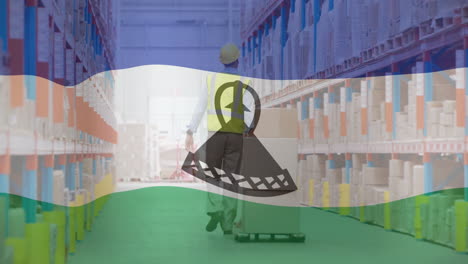 Moving-pallet,-warehouse-worker-with-Lesotho-flag-animation-in-background