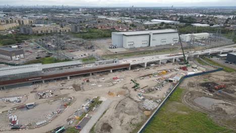 Barking-riverside-station-construction-August-2021-and-Barkingside-power-station-Essex-UK-Aerial-rise-and-pull-back