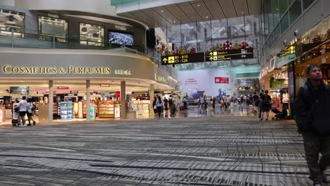 crowded mall with shoppers walking and interacting