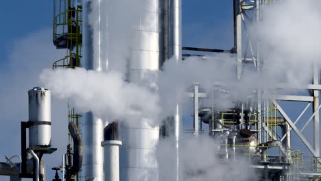 tanks pipes and smoking chimneys of the chemical plant