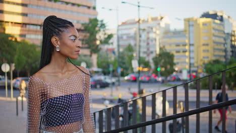 creative girl walk up stairs evening city closeup. brunette lady move stairway