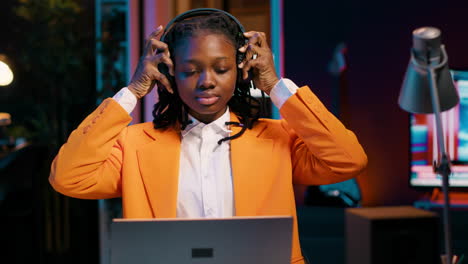 University student playing music on headphones to focus easily on college tasks