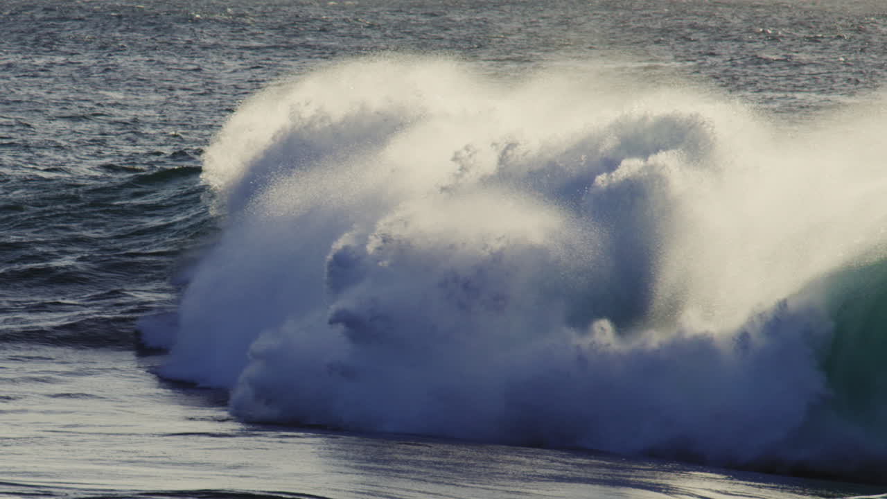Ocean wave texture with crashing foam ball, erupting in slow motion, golden hour sunset