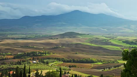 Panoramic-View-Of-Rural-Fields-And-Hills-In-Summer-In-Pienza,-Siena,-Tuscany,-Italy