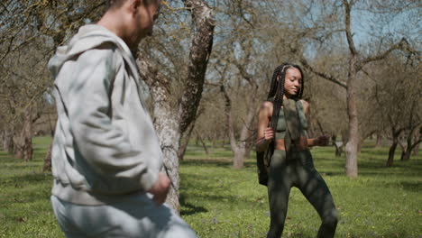 people dancing in the forest