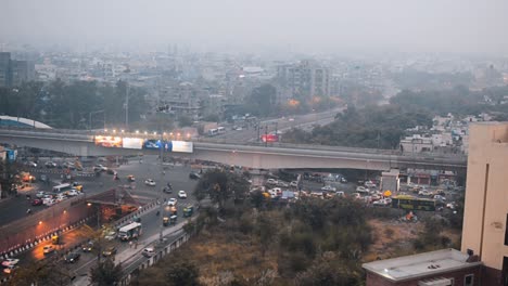 ariel view of city traffic road vehicles passing through at evening