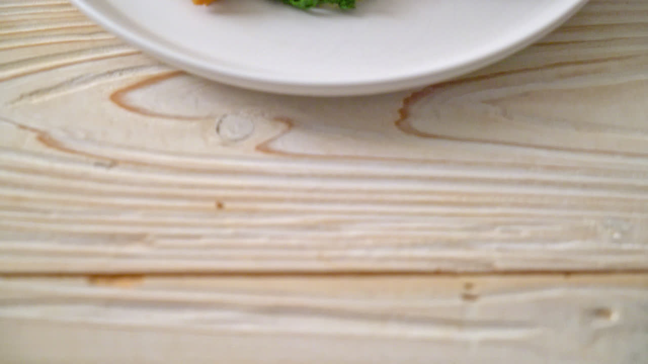 Stir-fried rice vermicelli and water mimosa with crispy pork belly