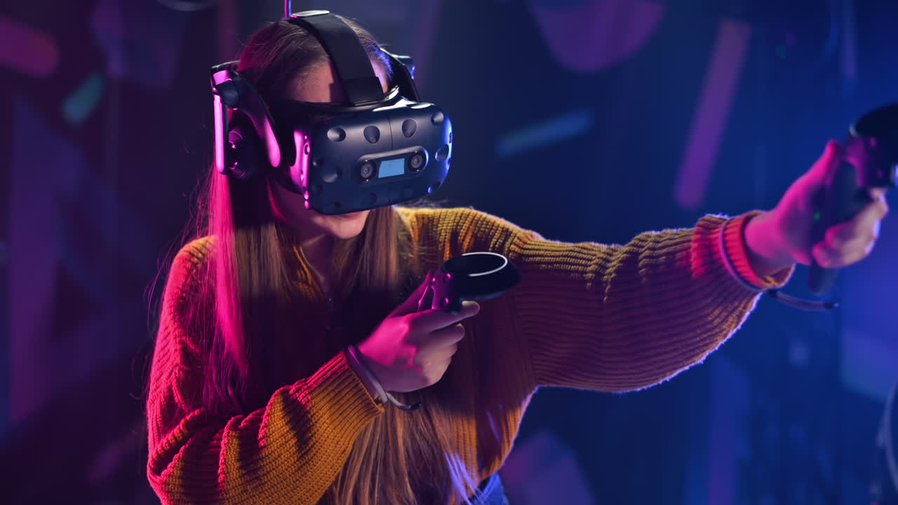 A joyful, interested girl is playing on VR treadmill with helmet, controllers and a backpack