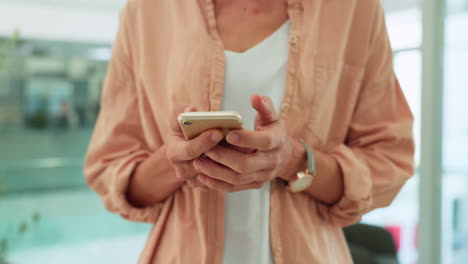 Smartphone,-typing-hands-and-woman-in-office