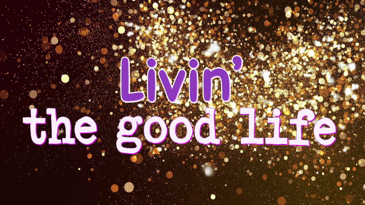 황금빛 반이는 배경 위에 'livin' good life'를 읽는 텍스트 애니메이션