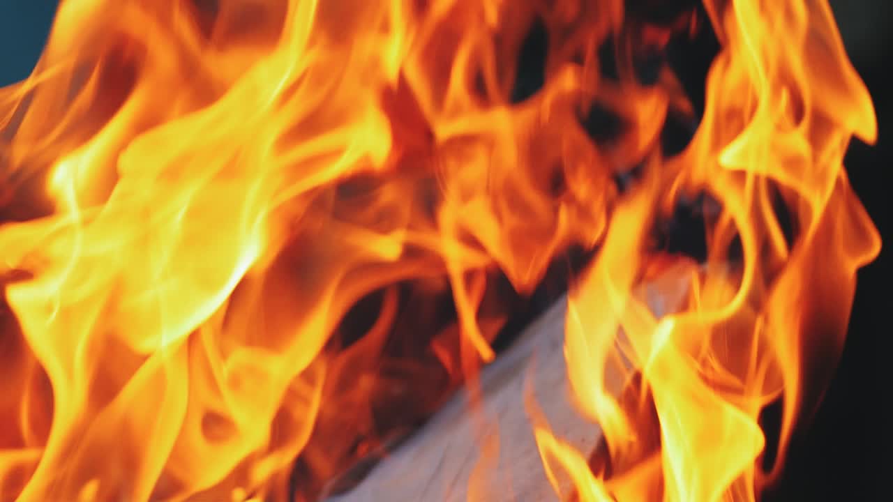 Burning fire in a home fireplace. Slow motion