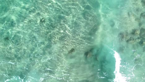 aerial view of turquoise ocean waves