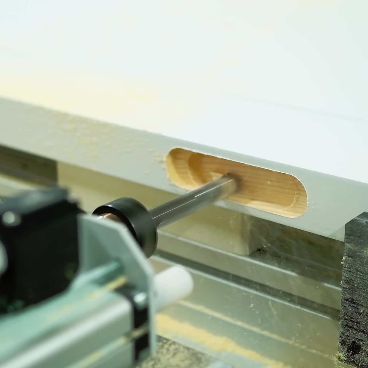 Machine tool for making doors. Process of manufacturing wooden doors on production equipment. Door industry. Close-up.