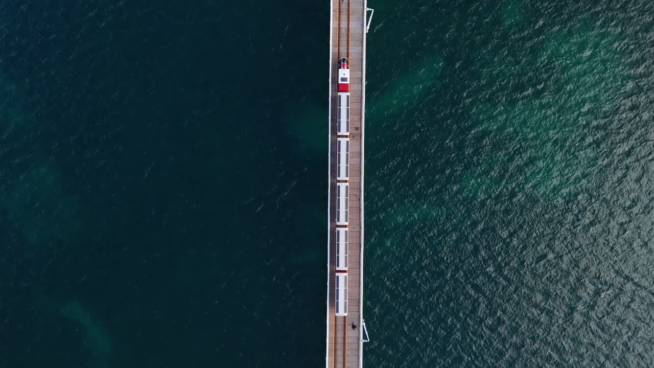 Top down view of drone following train along the Busselton Jetty in Western Australia