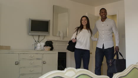 young couple arriving in boutique hotel room shot on r3d