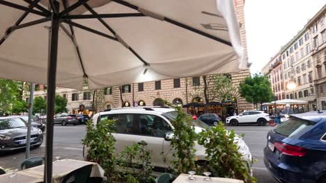 cars passing by outdoor cafe in florence