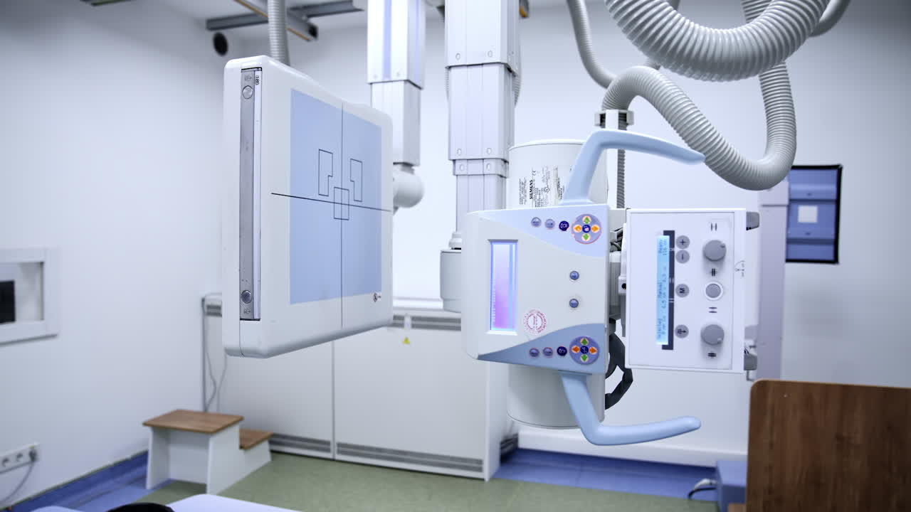 Modern innovative X-ray equipment in up-to-date hospital. Radiological room in clinics with no people. Panning footage.