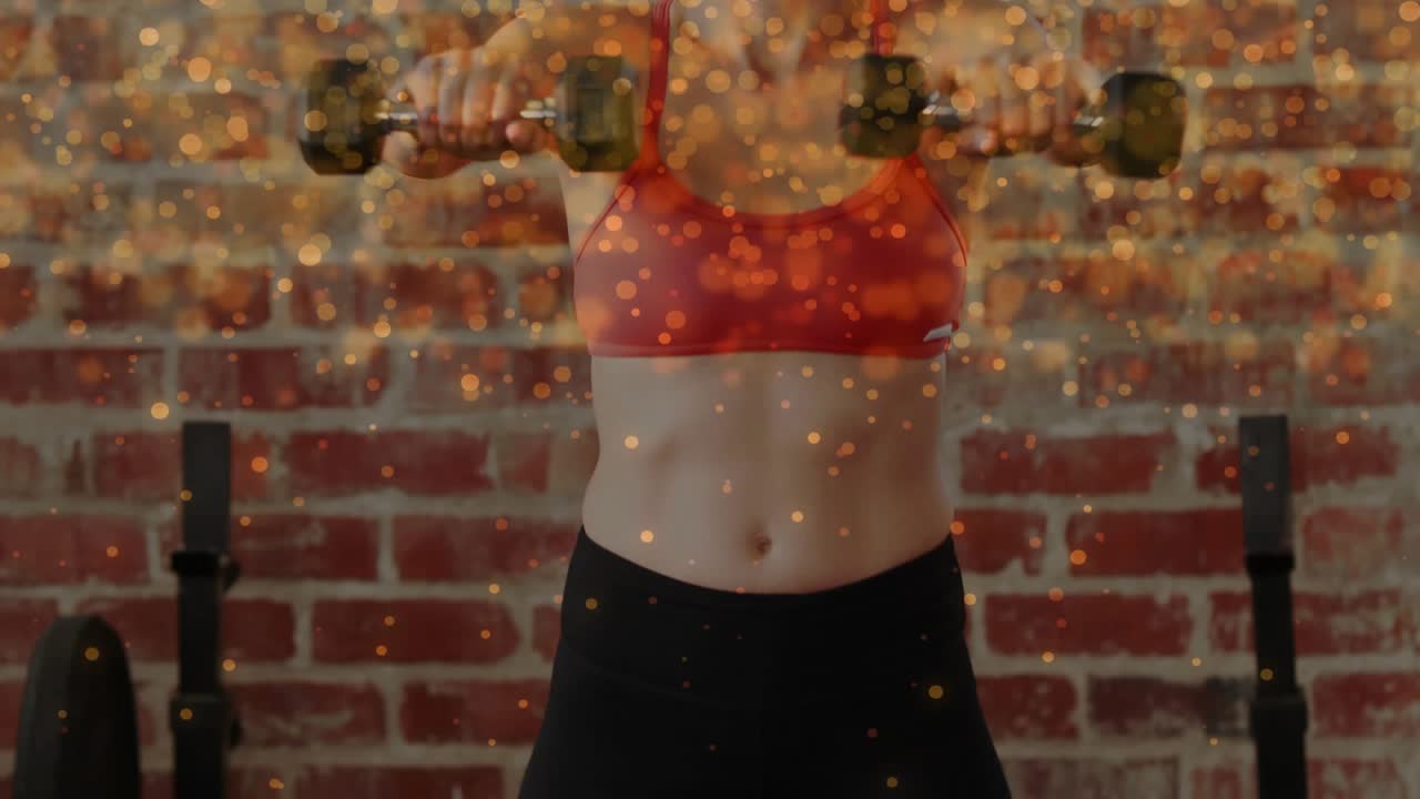 Woman doing dumbbell shoulder raises from chest hold in gym, golden sparks over brick, for strength
