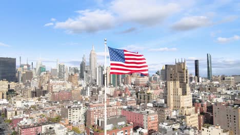 american usa flag waiving in the wind with new york city in the background