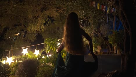 slowmotion coming into focus shot of a woman dancing alone in a forest in arillas, crofu