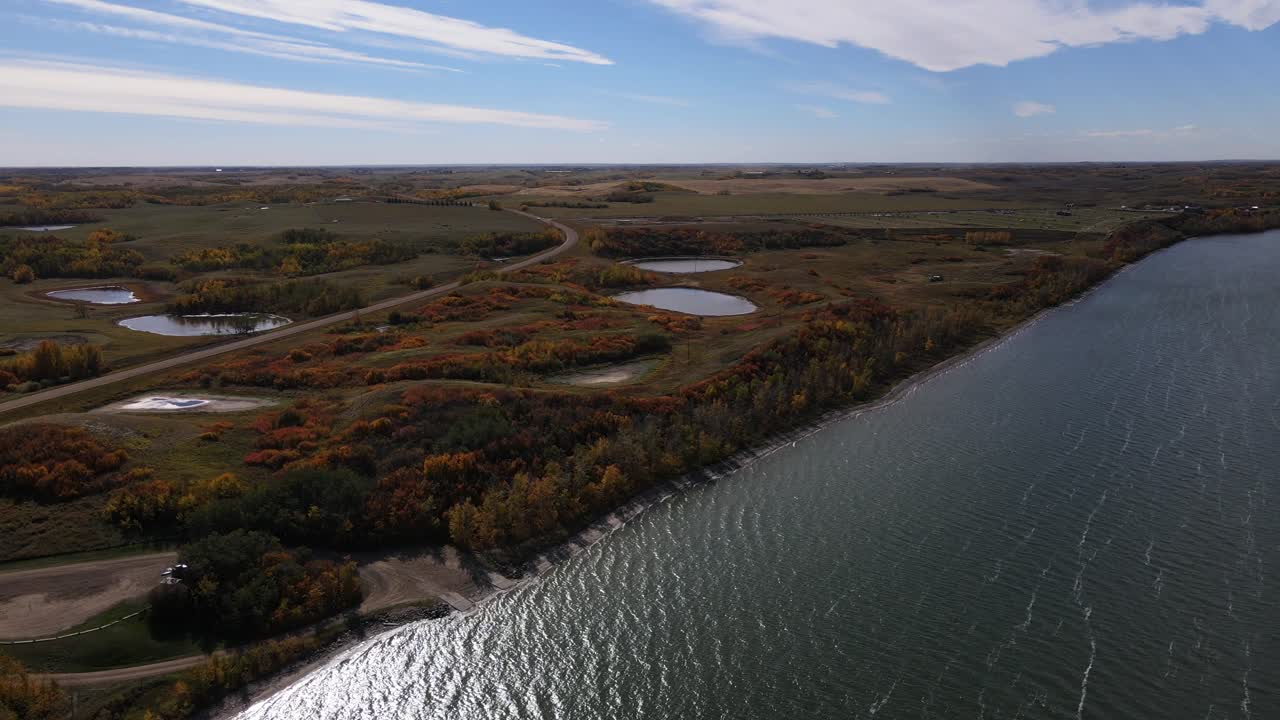 Descending aerial footage in 4k over Buffalo lake in Canada during fall 2021